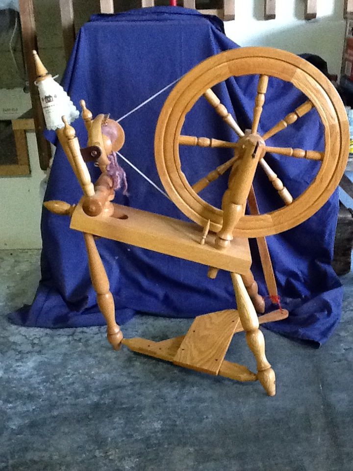 Handcrafted oak spinning wheel with accessories. Made by Rick Reeves and signed by him.