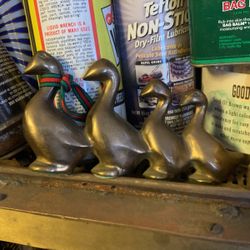 Four Brass Ducklings