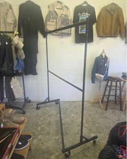 2-tier clothing rack, rolls around smoothly