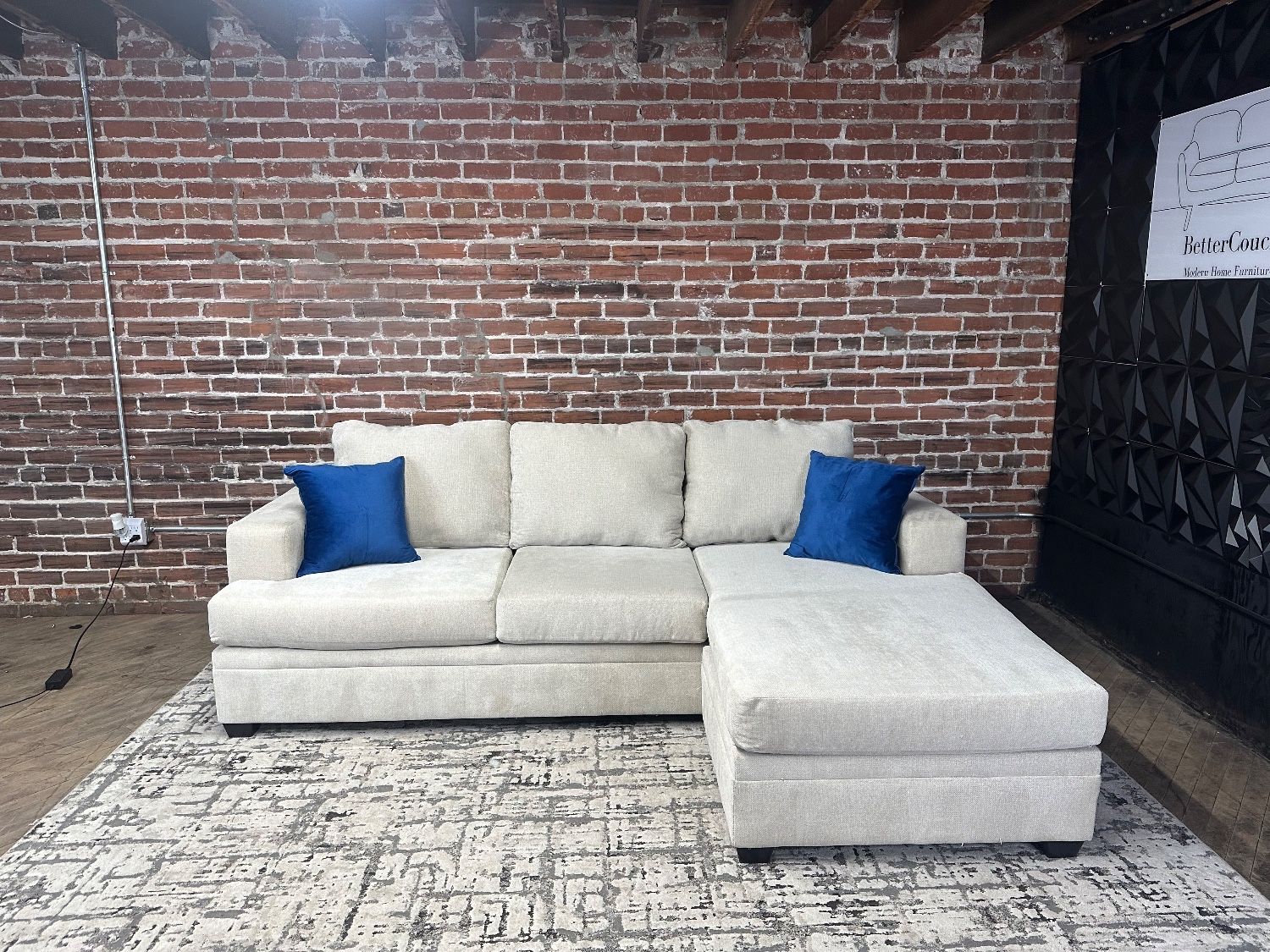 Delivery Available Living Spaces cream sectional sofa couch