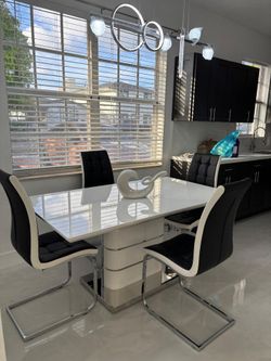 Spectacular dining set. Table with 4 chairs. $100 down payment. Ask for price.