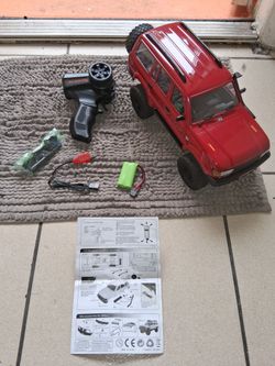 Off road rc crawler comes with 2 batteries extra parts charger and Transmitter And manual has head lights firm price $65
