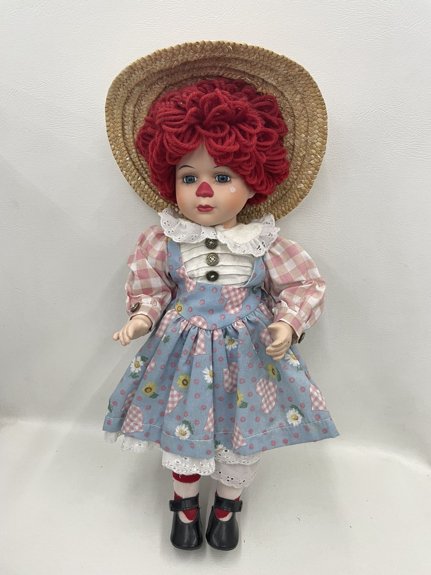 Raggedy Ann Porcelain Doll. Item No 516 (Shopgoodwill)