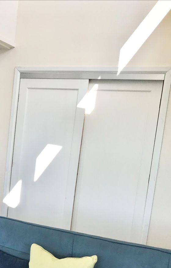 Two Solid Wood Sliding Closet Doors With Mounting Bracket And Rollers.