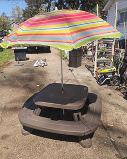 Very large children's picnic table with umbrella.. the price is firm