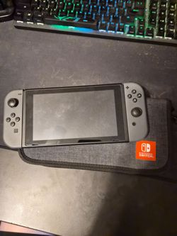 Nintendo Switch with Gray Joy-Cons and Case