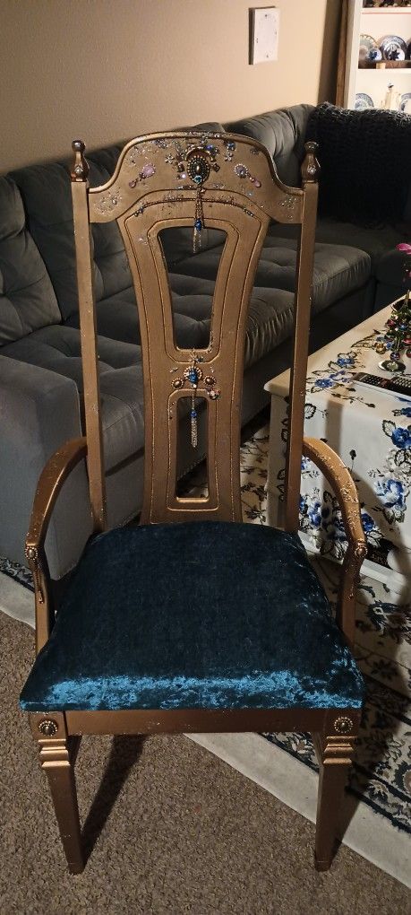 One Of A Kind Chair. A Shiny Matt Gold With Soft Blue Cushion.