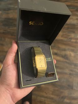 vintage gold-tone Seiko quartz tank-style watch