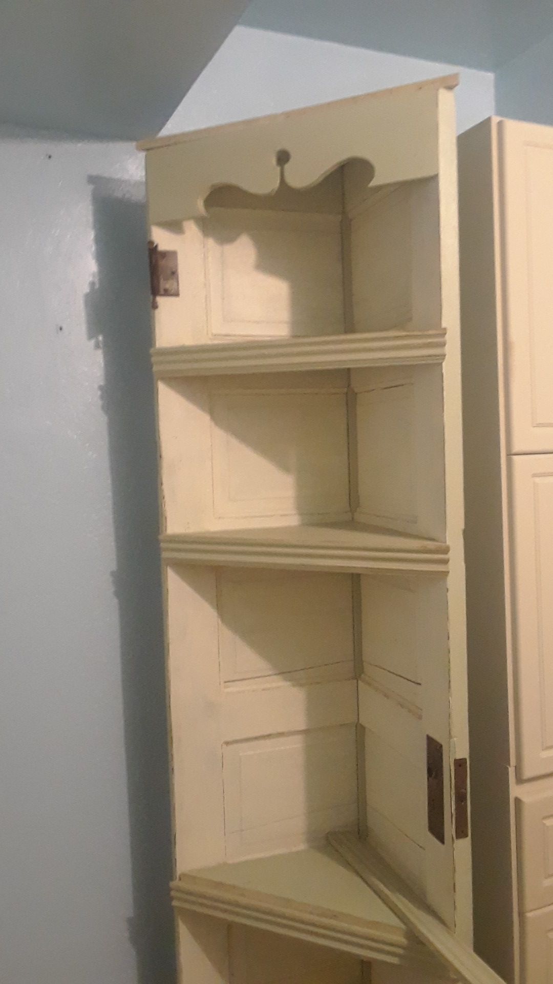 Corner shelf made from old door