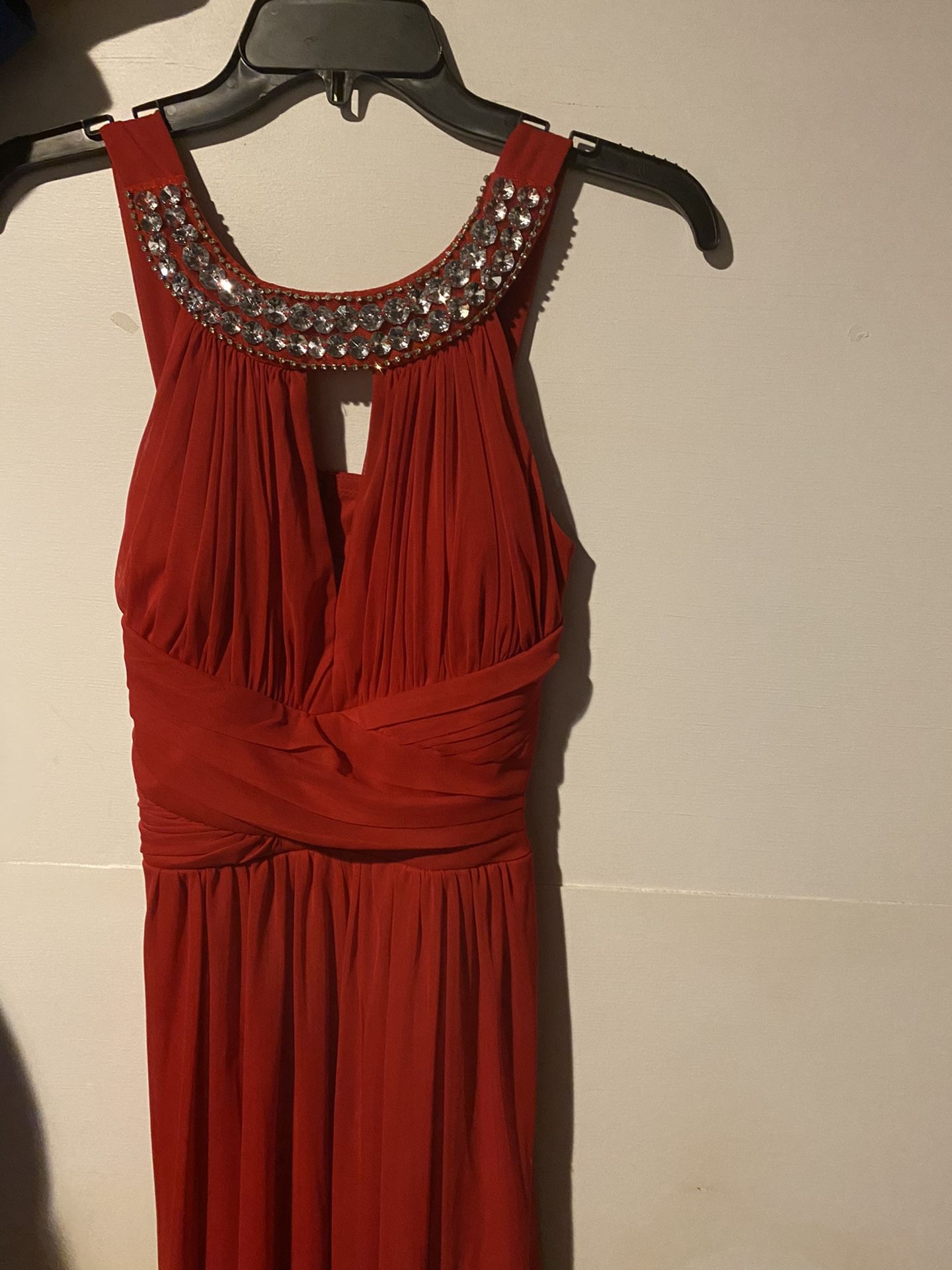 Elegant red dress. Only worn once then laundered and stored in clothing bag since.