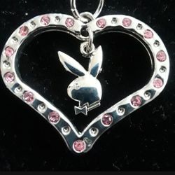 Silvertone Playboy pendant necklace with pink stones. Brand new! Only $30.