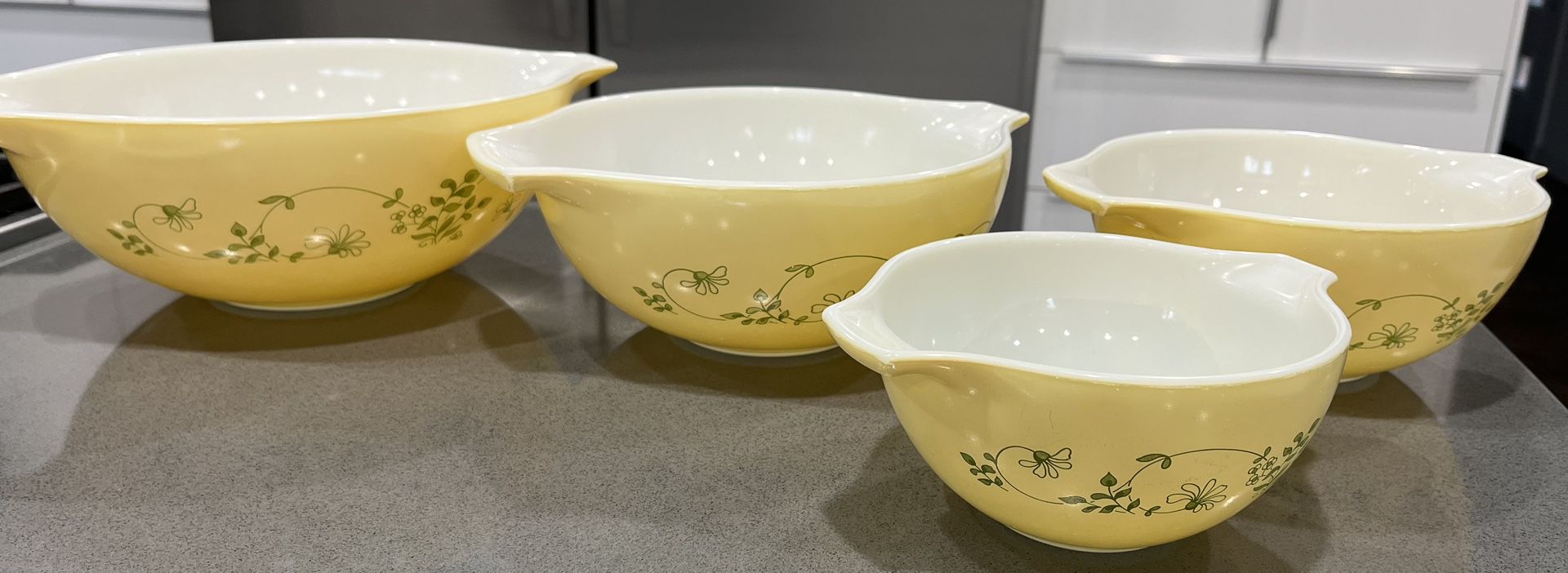 Vintage set of four PYREX Shenandoah Cinderella mixing bowls in yellow.