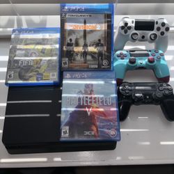 PS4 with cables and three controls and three games