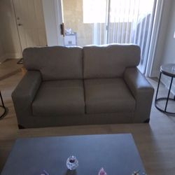 Brand New Grey Leather Loveseat, 70 Inches  Long. Brand New Sofa Legs Never  Opened.  Does Not Work  For Me And My Space. Price $1099. Sell Asap!