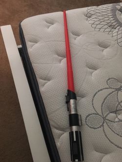 Red lightsaber. Good condition and nothing broken