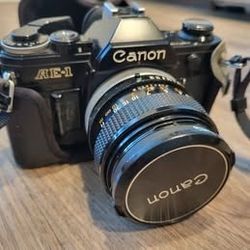 Vintage Canon AE-1 35mm Film Camera with leather case and SUNPAK auto 20SR Vintage Flash