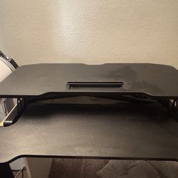 Adjustable table top standing desk
