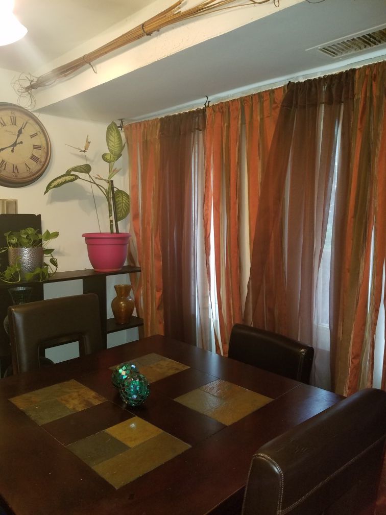 Dinning Table & 2 Brown leather barstools.