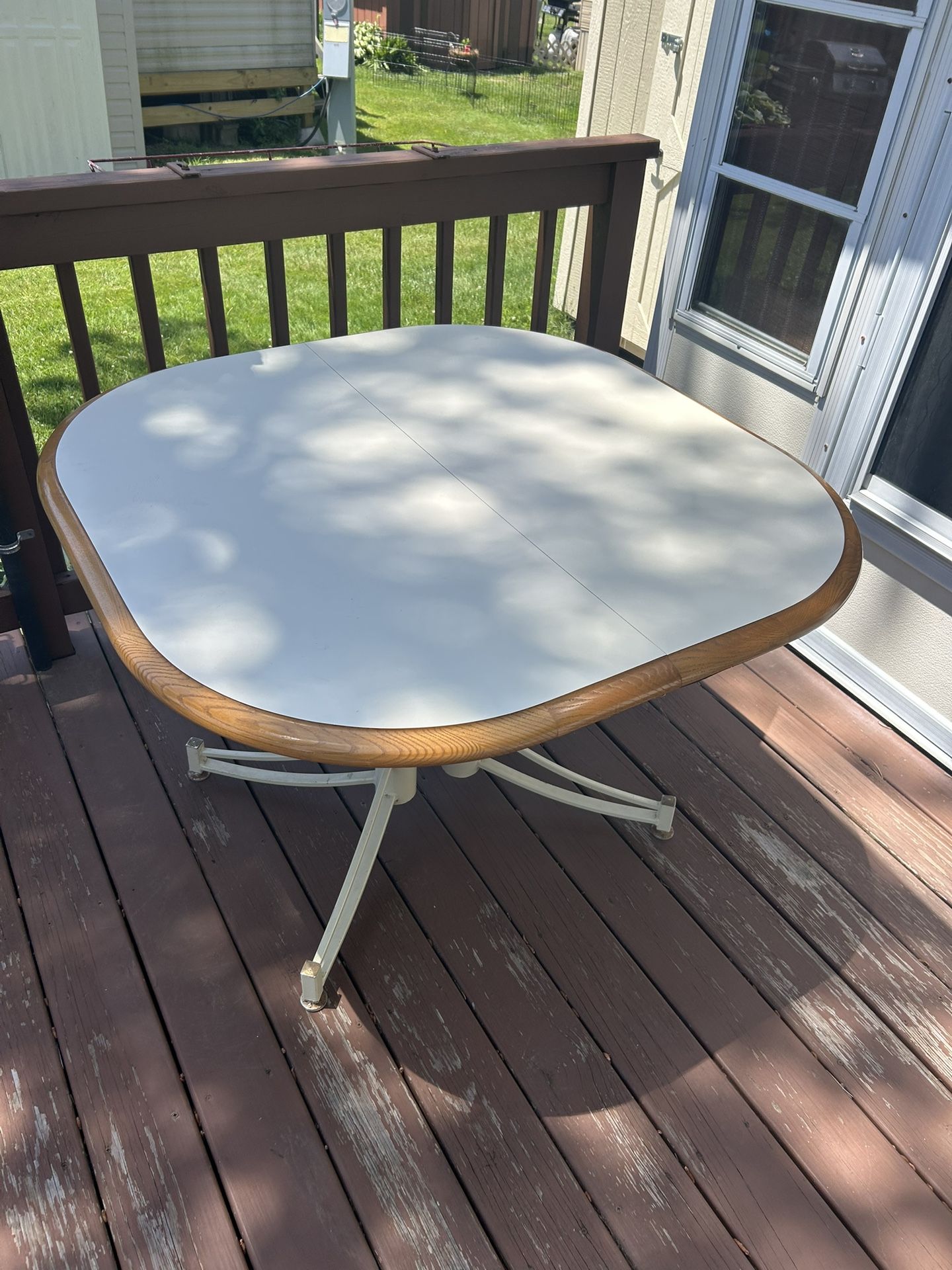 Sturdy 41 x 41” Kitchen table cream colored formica wood trim with leaf