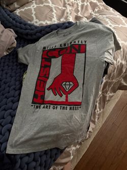 Gray Rick and Morty short-sleeve graphic tee with bold red and black Heist Con artwork.
