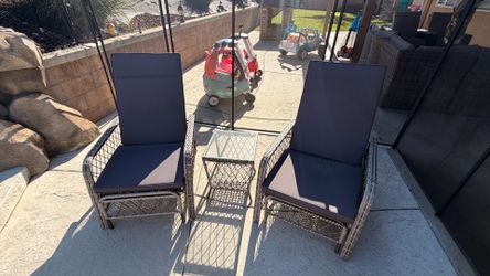 Two adjustable lounge chaise chairs with table grey