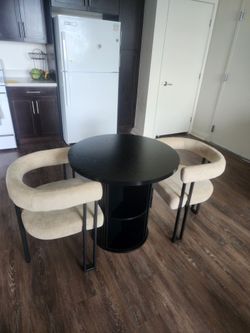 Black round dinning table with 2 chairs
