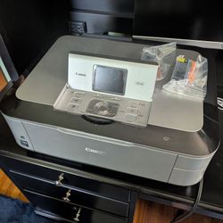 Canon Pixma MP640 Wireless Photo All-In-One Printer

2 Black cartridges included
Works great

Canon MP640
Highlights
Up To 9600 x 2400dpi Resolution
4
