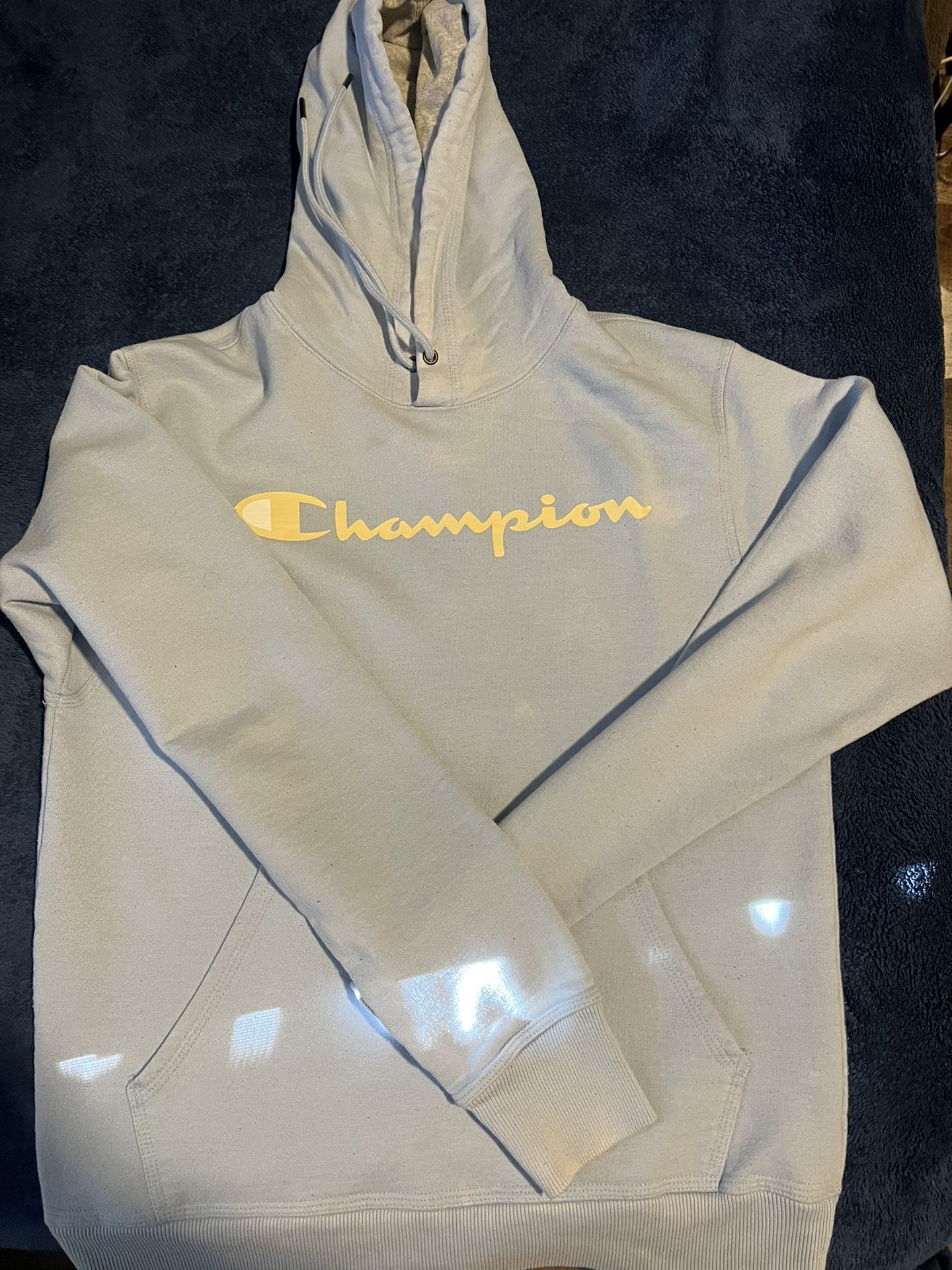 Sky blue Champion hoodie with yellow text