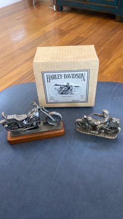 A pair of Harley Davidson motorcycles models in Pewter from the early 1990’s