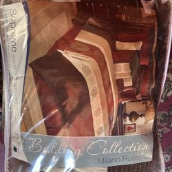 Brand new king comforter set by Ashley