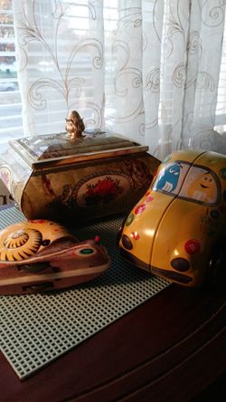 Two Tins and a tin toy