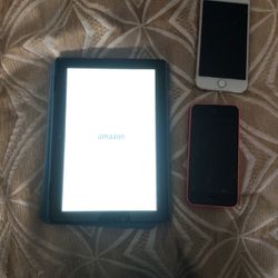 Amazon Kindle And Two Old iPhones