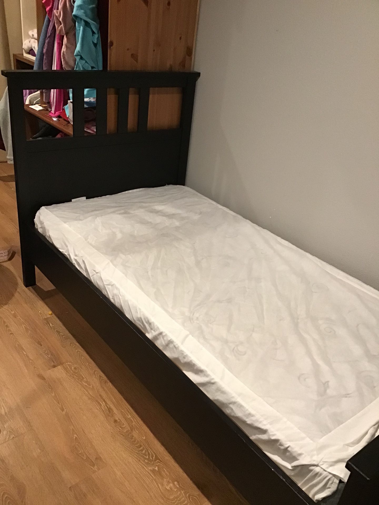 Brown frame twin bed