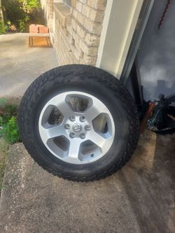 18" Dodge Ram 1500 OEM Wheels & Falken Wildpeak A/T (at3wa) Tires