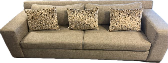 Modern sofa is upholstered in a gray textured fabric