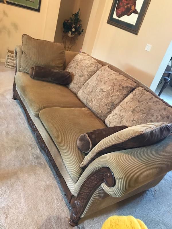 Brown sofa, ottoman, Chair