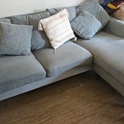 L Shaped Light Blue Couch With Pillows