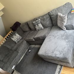 Gray Sectional/couch with Decorative Pillows And Area Rug Price Negotiable