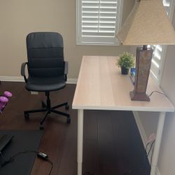 table with chair and table lamp