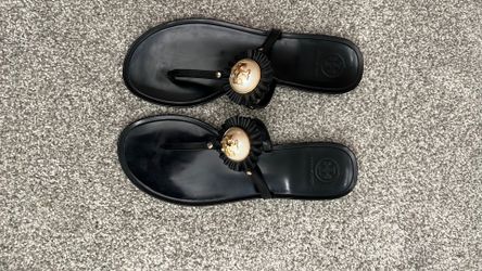 Tory Burch, black with gold pearl on the emblem size 8