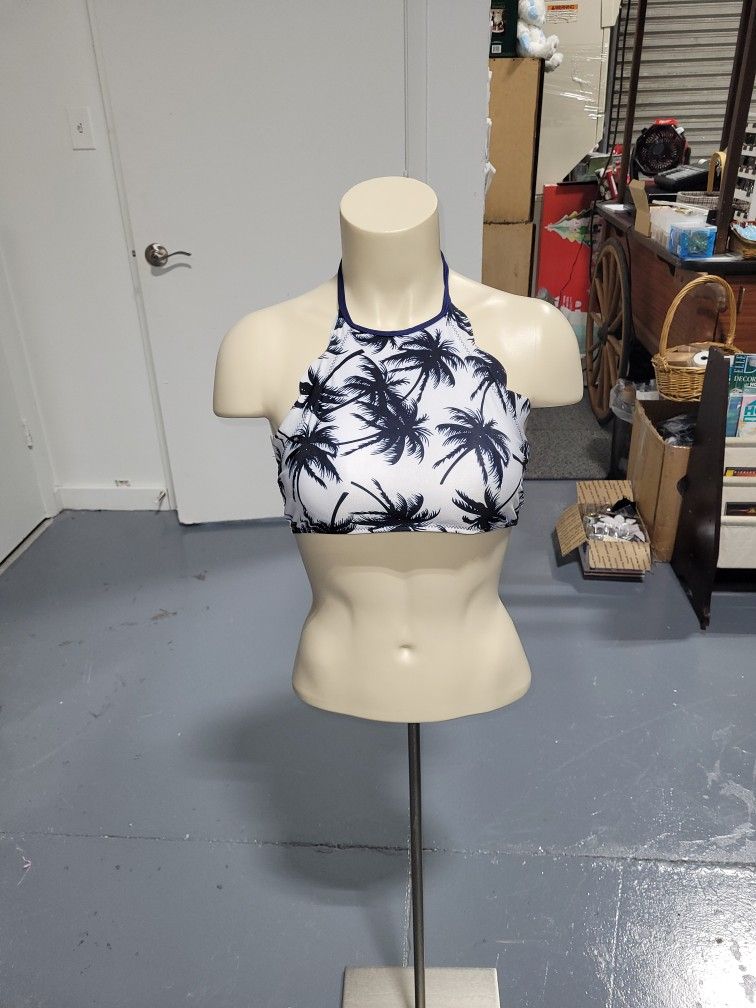 Stylish halter bikini top with palm tree print. Perfect for beach days.