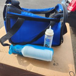 Dog Carrier And A Dog Bed Stand