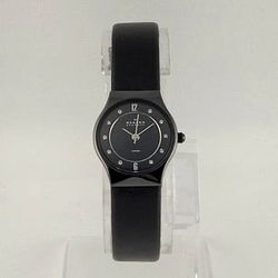 SKAGEN WOMEN'S CERAMIC AND STAINLESS STEEL WATCH, BLACK DIAL WITH JEWEL HOUR MARKERS, BLACK GENUINE LEATHER STRAP