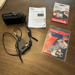 Nikon Cool Pix S9900 camera and accessories
