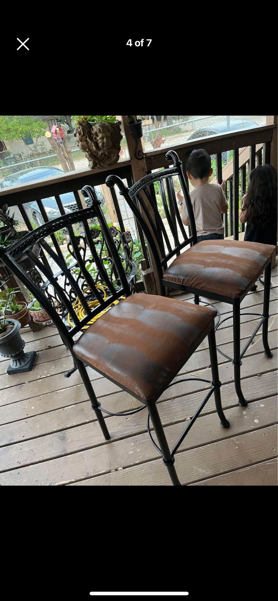 2 bar stools with new seat covers snake brown design.