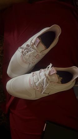 Pink and white puma golf shoes