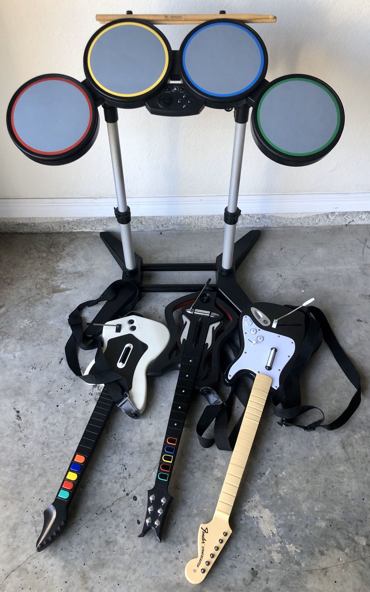 Rock band drums with three wireless guitars