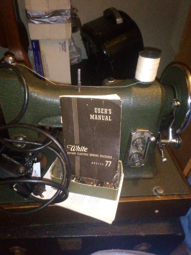 White Sewing Machine In The Case