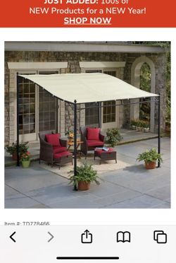 FREESTANDING CANOPY.  NEW IN BOX.  HEAVY AND LONG.  NEED 2 PEOPLE TO MOVE IT.