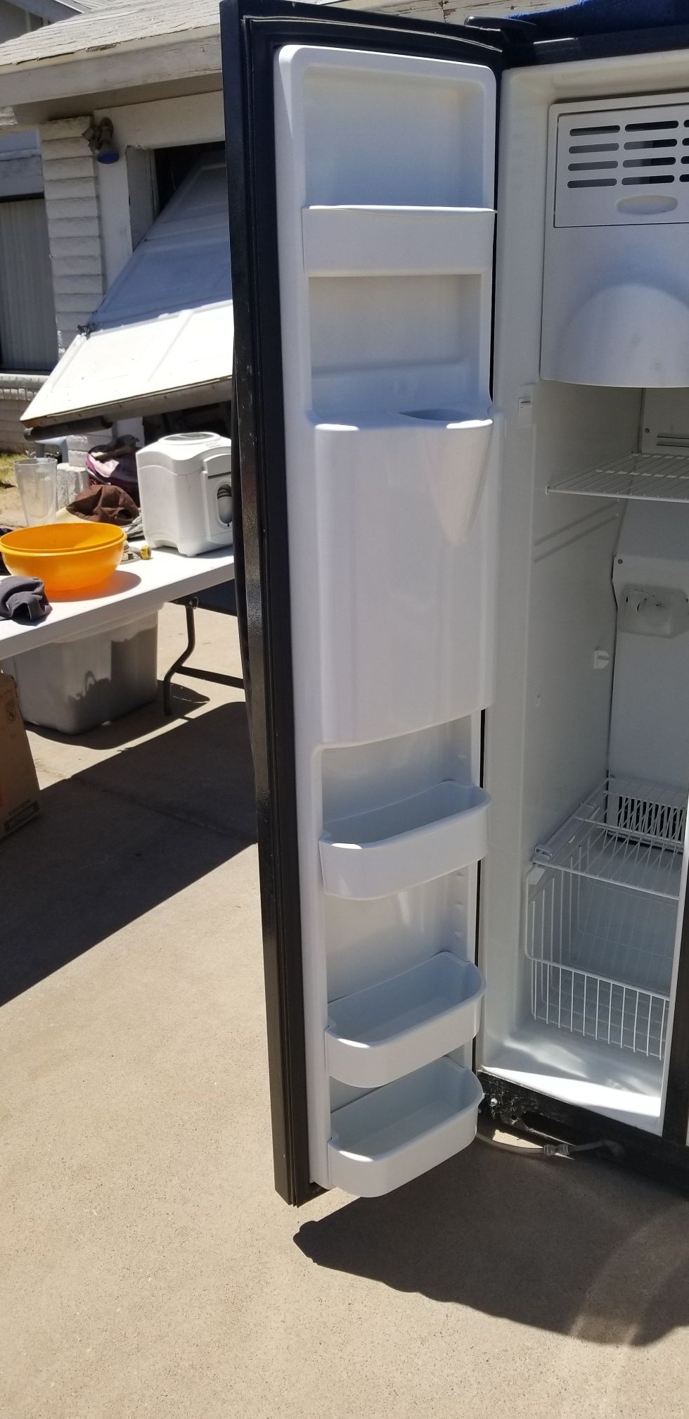 Black Amana fridge with Ice machine and filtered water dispenser for